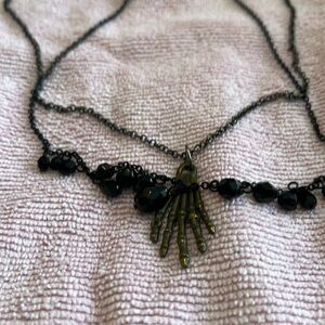 Necklace, witch’s hand pendant, black beads, second strand, gunmetal chain